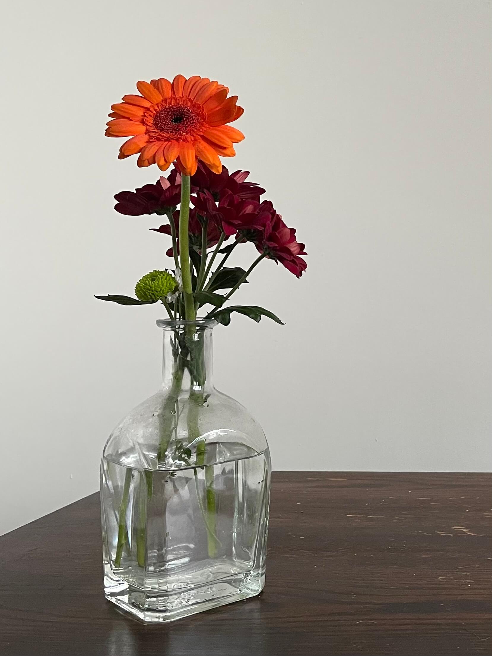 flower in vase on wooden table